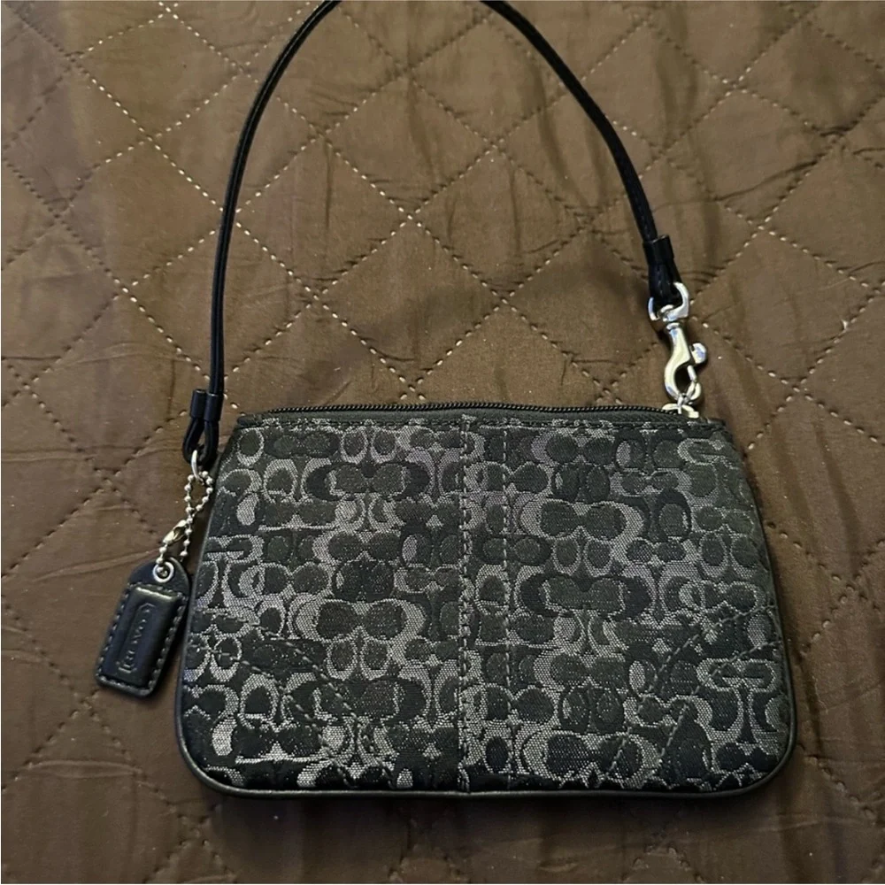 Coach Monogram Wristlet in Black silver with Metallic Elements and leather strap